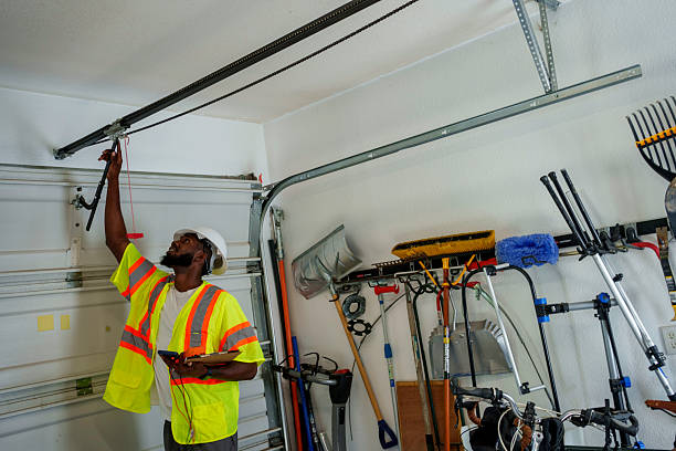 Professional Garage Door Panel Replacement technician working in Clinton, MS